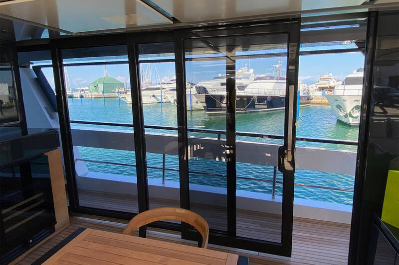 Dining area on main deck with sliding doors on sides