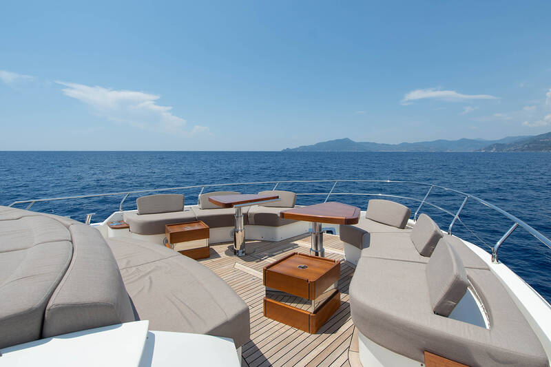 Lounge area with sunbathing cushions on bow