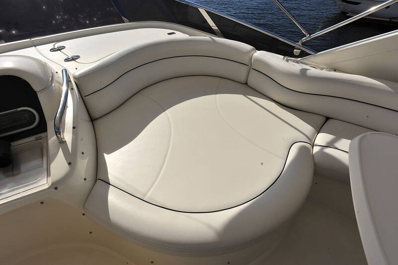 A large sofa in front of the flybridge