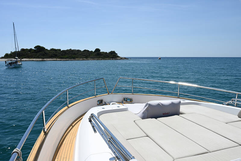 Lounge area with sunbathing cushions on bow