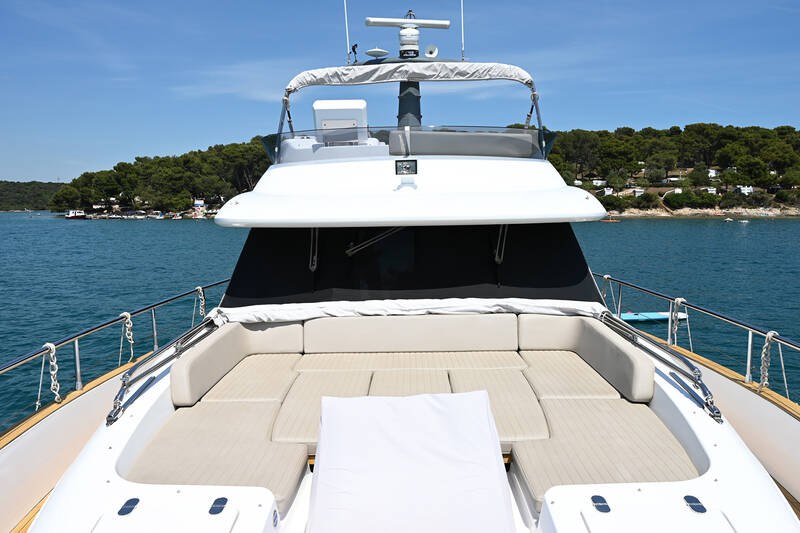 Lounge area with sunbathing cushions on bow